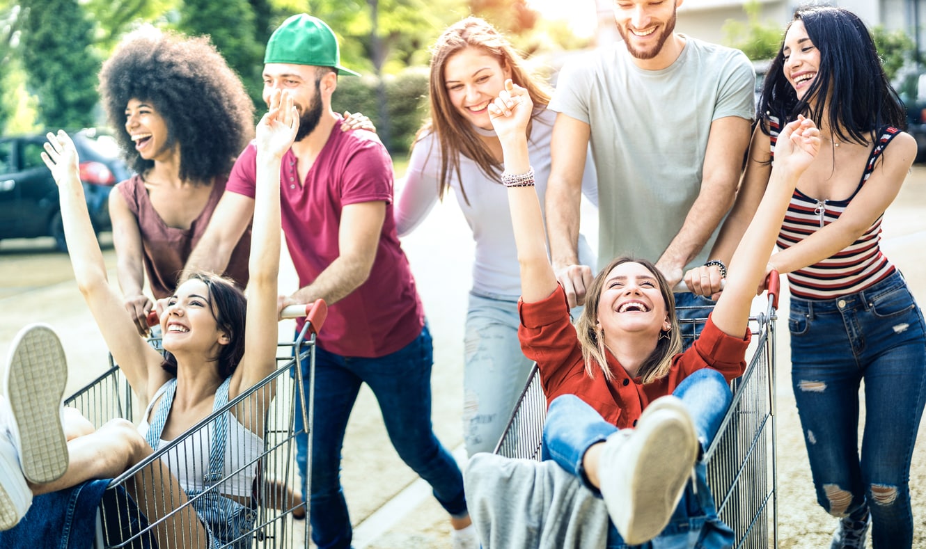 Group of happy and diverse Gen Z people shopping, showing a concept of effective Gen Z advertising.